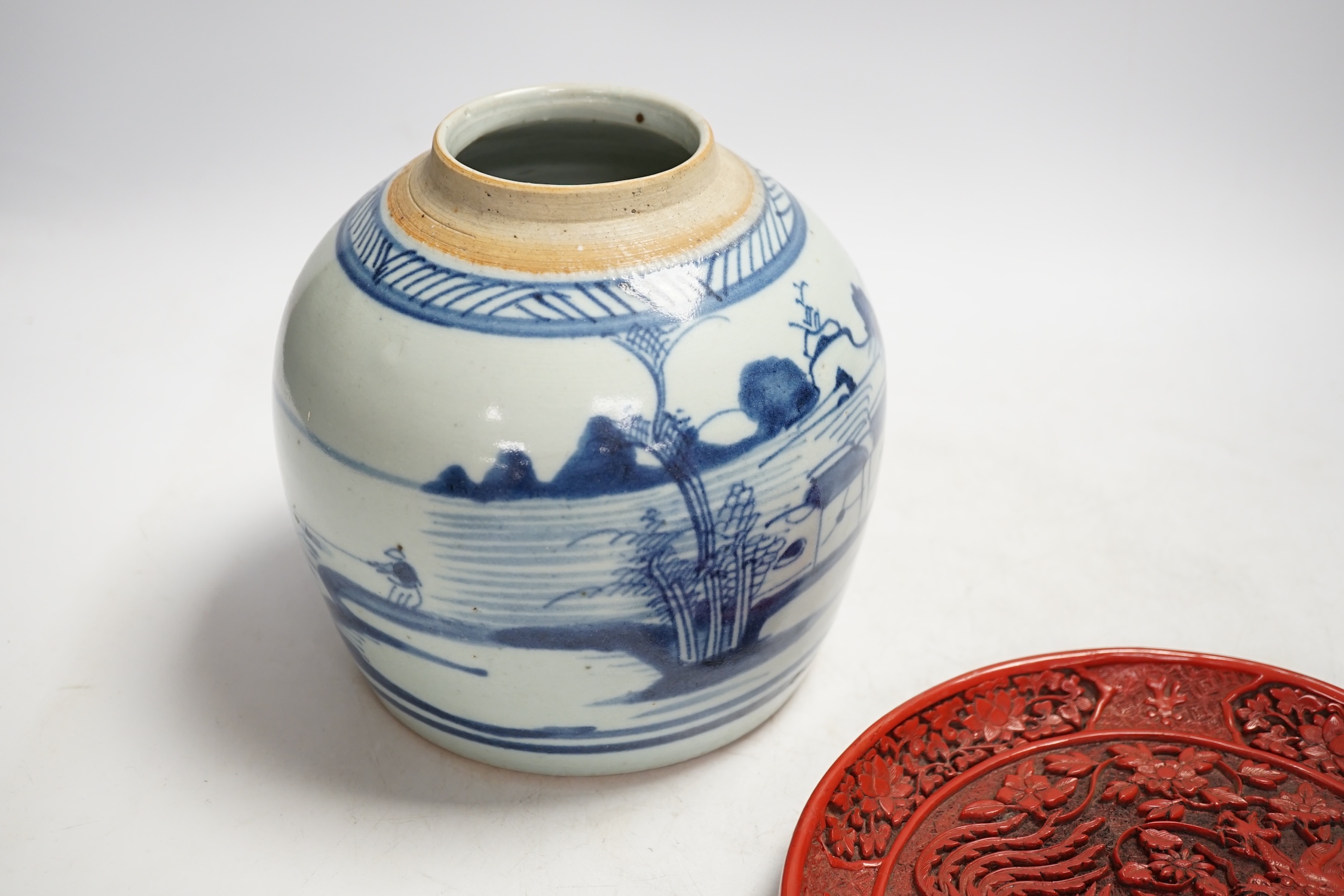 A Chinese blue and white jar and red cinnabar style lacquer tray, jar 16.5cm high. Condition - fair